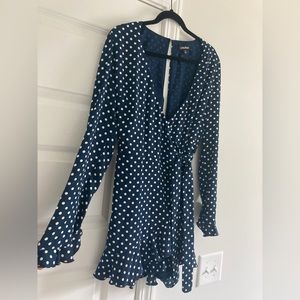 Ruffle trimmed wrap romper with long sleeves. Very flattering and comfortable!